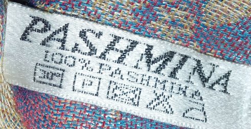 围巾上的100%pashmina啥意思?